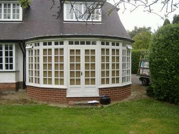 Mr J : Gayton Wirral : Replacement of timber frames with Evolution storm 2 white wood PvcU windows and doors with Astragal bar design to match existing 